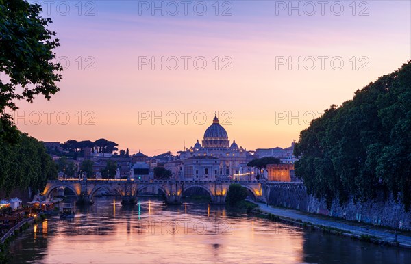 Saint Peter's Basilica with Sant' Angelo's Bridge over Tiber at sunset