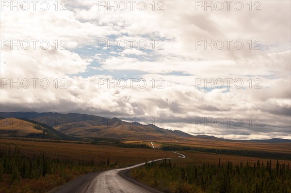 Dempster Highway under clouded sky