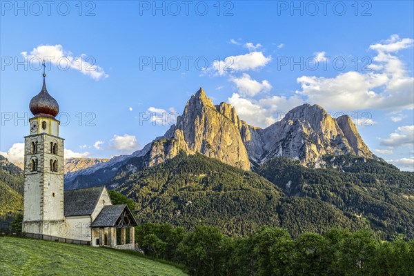 San Valentino church in front of the Schlern and moon at sunset