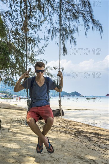 Young man on swing