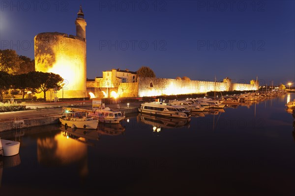 Defence tower Tour de Constance with city walls at night