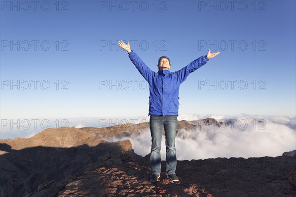 Woman on the edge of the Caldera de la Taburiente on the Roque de los Muchachos