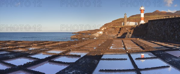 Saltworks Teneguia in front of Faro de Fuencaliente lighthouse