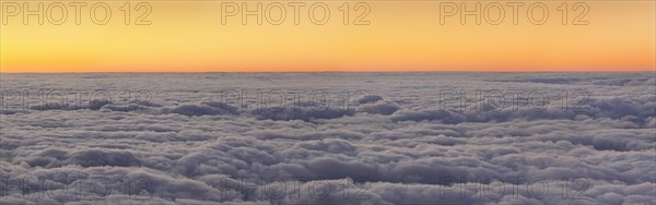 Sunset above the clouds