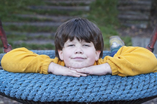 Boy in a swing nest