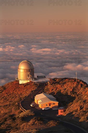 Observatory on the Roque de los Muchachos with clouds at sunset