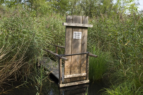 Small jetty with a sign