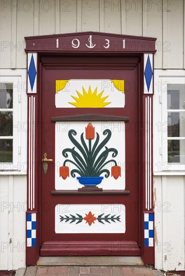 Traditionally painted door of a captain's house