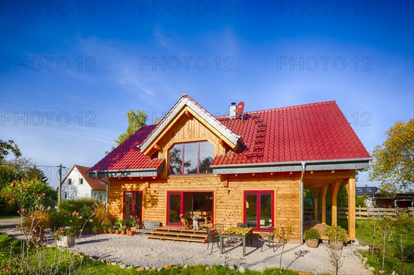 Modern log house made of larch with terrace
