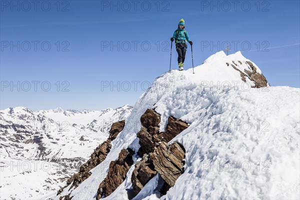 Climber descending from the summit ridge of the Finailspitze peak at Val Senales glacier