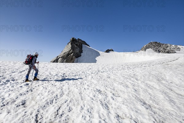 Mountaineer on Schwarzenstein summit ridge