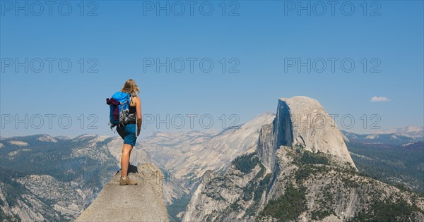 Hiker standing on a cliff