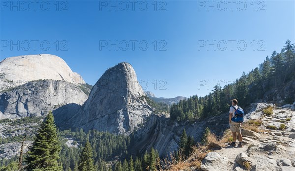 Walker looking on Liberty Cap