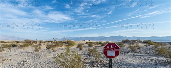 Sign lettering "STOP Extreme Heat Danger" warning of heat