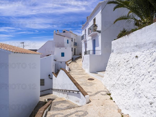 White houses in narrow alleyway