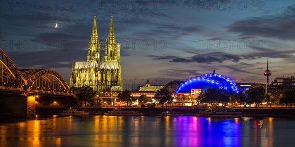 City-panorama of Cologne at dusk