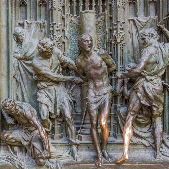 Bronze sculptures at the entrance portal of Milan Cathedral