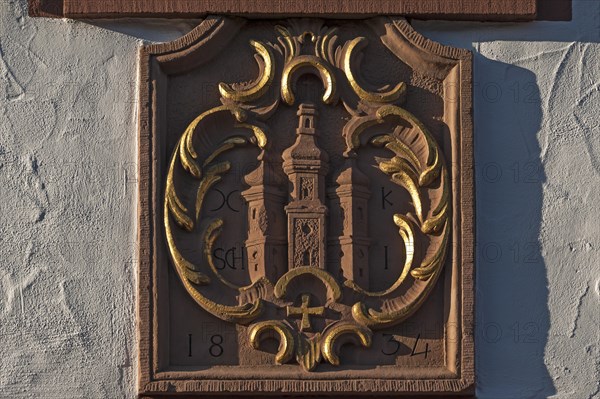 Sandstone relief with the old coat of arms of Ettenheim on a house facade