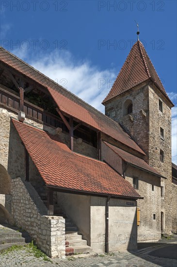 Medieval town wall with tower and battlements