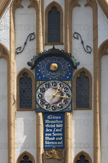 Moondial at the Gothic facade of the Town Hall