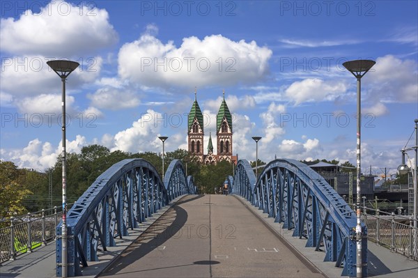 Herz Jesu church behind Wiwilibrucke