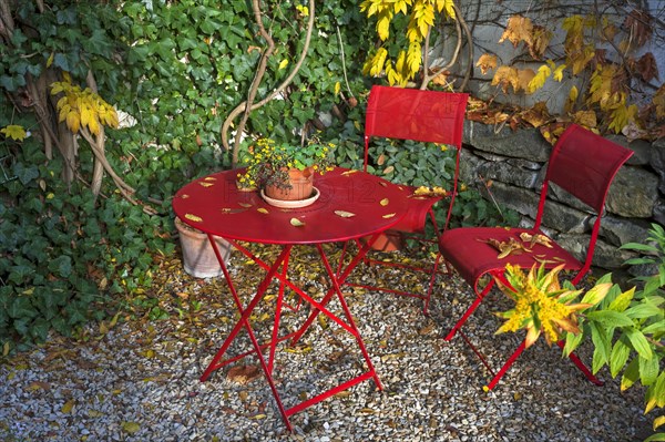 Patio with red garden furniture