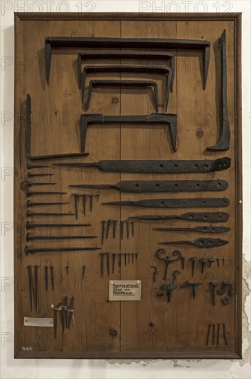 Board with hand-forged nails and staples