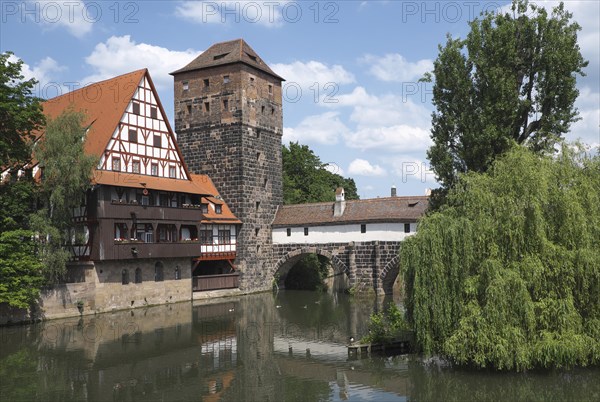 Old timbered houses and hanging tower and bridge