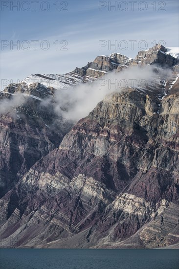 Unfolded coloured rock strata