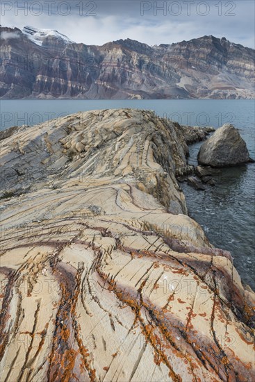 Unfolded coloured rock strata