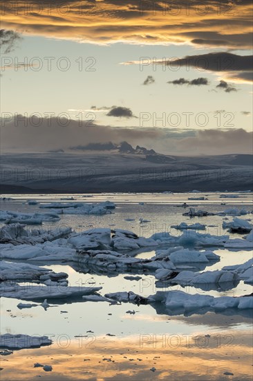 Small icebergs in the glacier lagoon Jokulsarlon at sunset