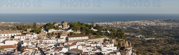 Panoramic view of village and coastal resort of Mijas