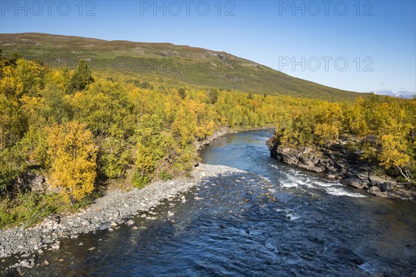 Abiskojokk river in autumnal landscape