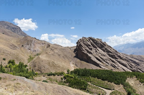 Steep towering rock and ruins of Alamut mountain fortress