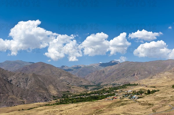 View of villages Koushk and Zavardasht in mountain landscape at Ovan Lake