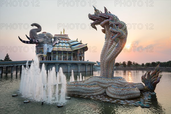 Seven-headed Naga serpent and fountain in front of the Elephant Temple Thep Wittayakhom Vihara