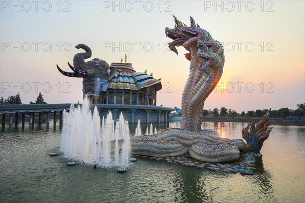 Seven-headed Naga serpent and fountain in front of the Elephant Temple Thep Wittayakhom Vihara