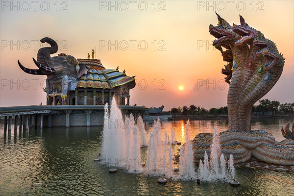 Seven-headed Naga serpent and fountain in front of the Elephant Temple Thep Wittayakhom Vihara