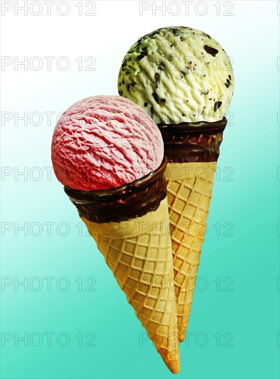 Two ice cream cones with scoops of ice cream