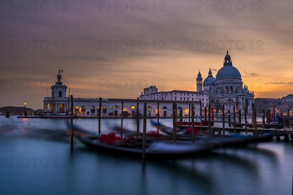 Gondolas and Santa Maria della Salute at sunset