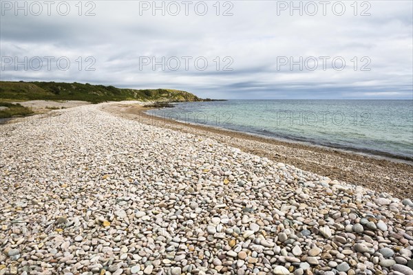 Pebble beach at end of Claggain Bay