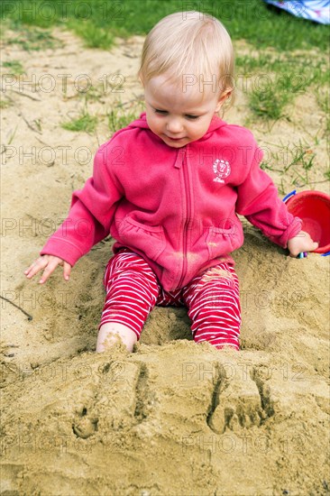 Toddler playing in the sand