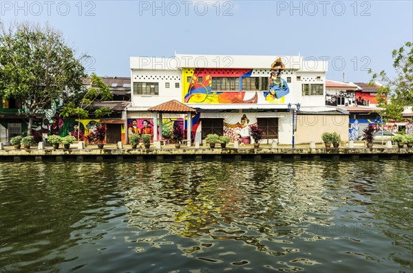 Brightly painted house fronts along the Malacca River