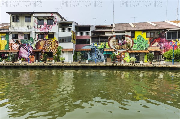 Brightly painted house fronts along the Malacca River