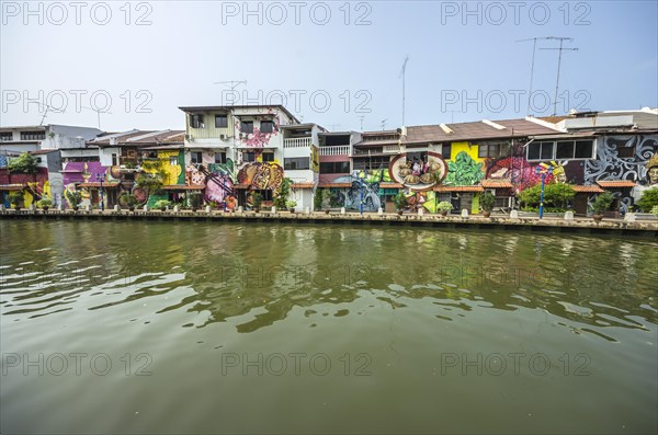 Brightly painted house fronts along the Malacca River