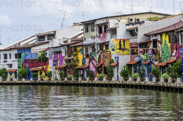 Brightly painted house fronts along the Malacca River