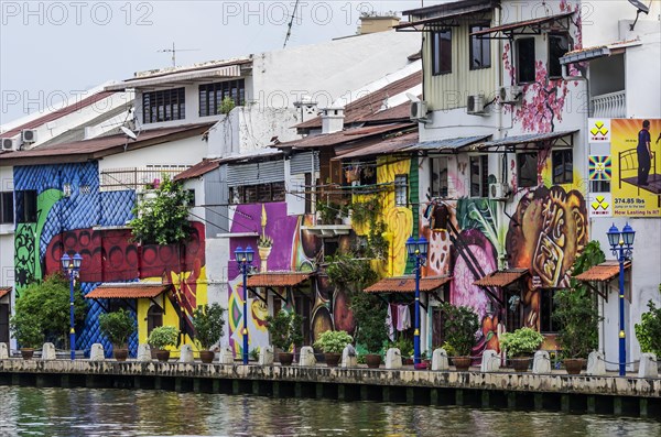 Brightly painted house fronts along the Malacca River