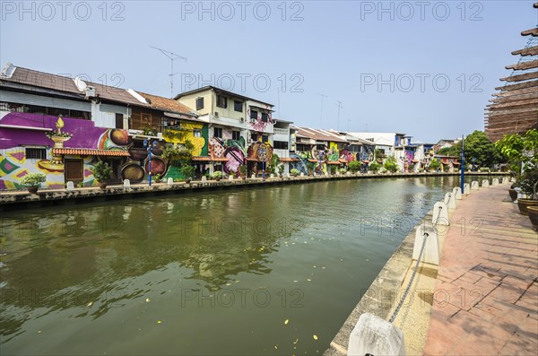 Brightly painted houses along the Malacca River