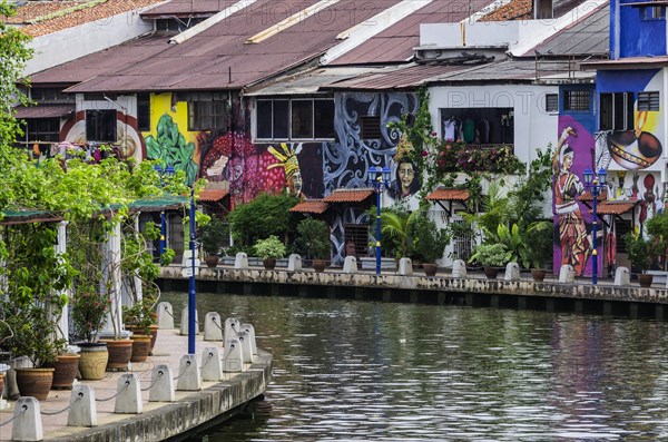 Brightly painted house fronts along the Malacca River