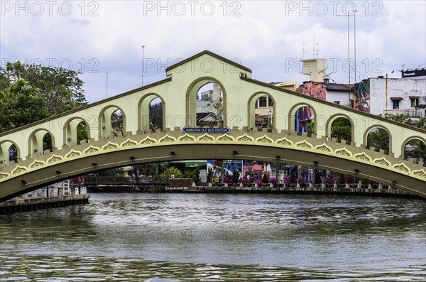 Old bridge over the Melaka river to the theme park